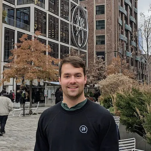 Zach Geier in front of Yext NYC building